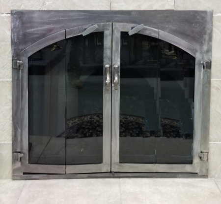 Chatham Square to Arch All natural iron finish with vice bi fold doors and standard forged center handles standard smoke glass comes with sliding mesh spark screen